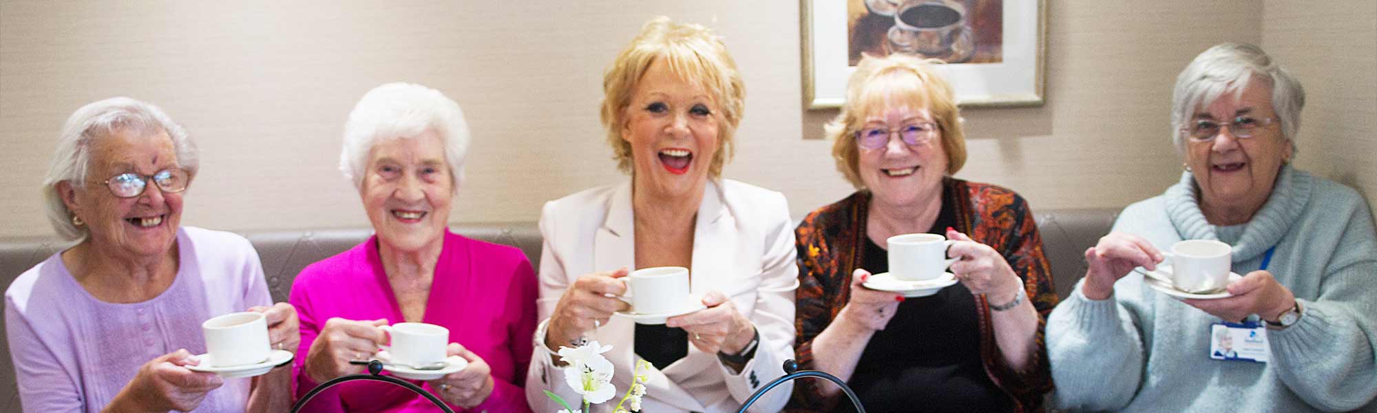 Sherrie Hewson visits Crispin Court Care Home tea resdients fun smiles women banner hero