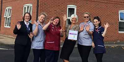 Amarna House Care Home CQC Good in all Categories team wave smiles