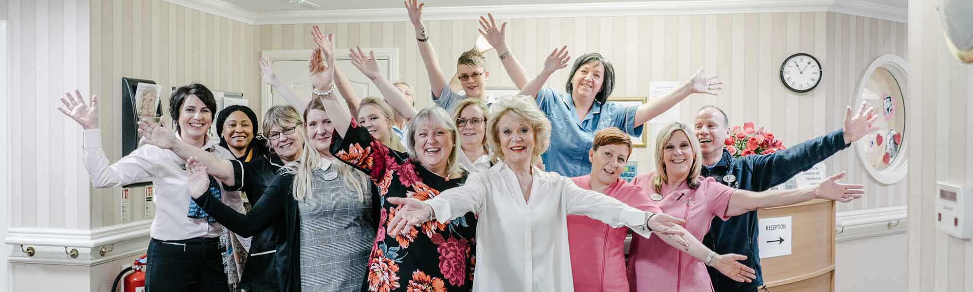 Acacia Mews Care Home Hatfield Sherrie Hewson staff employees jazz hands manager well-being smiles banner hero