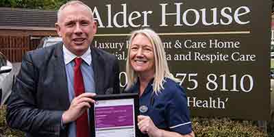 Alder House Care Home CQC Inspection staff celebrate certificate signage