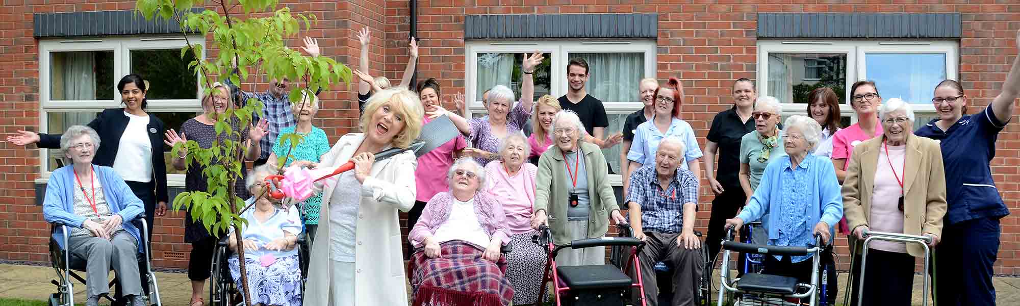 Sherrie Hewson with staff and residents from Acorn Lodge Care Home
