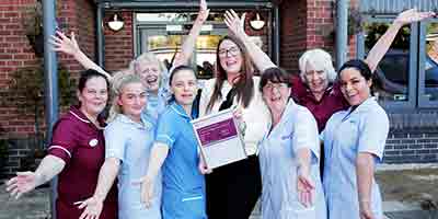 Joanna and team from Acacia Lodge celebrate CQC Outstanding