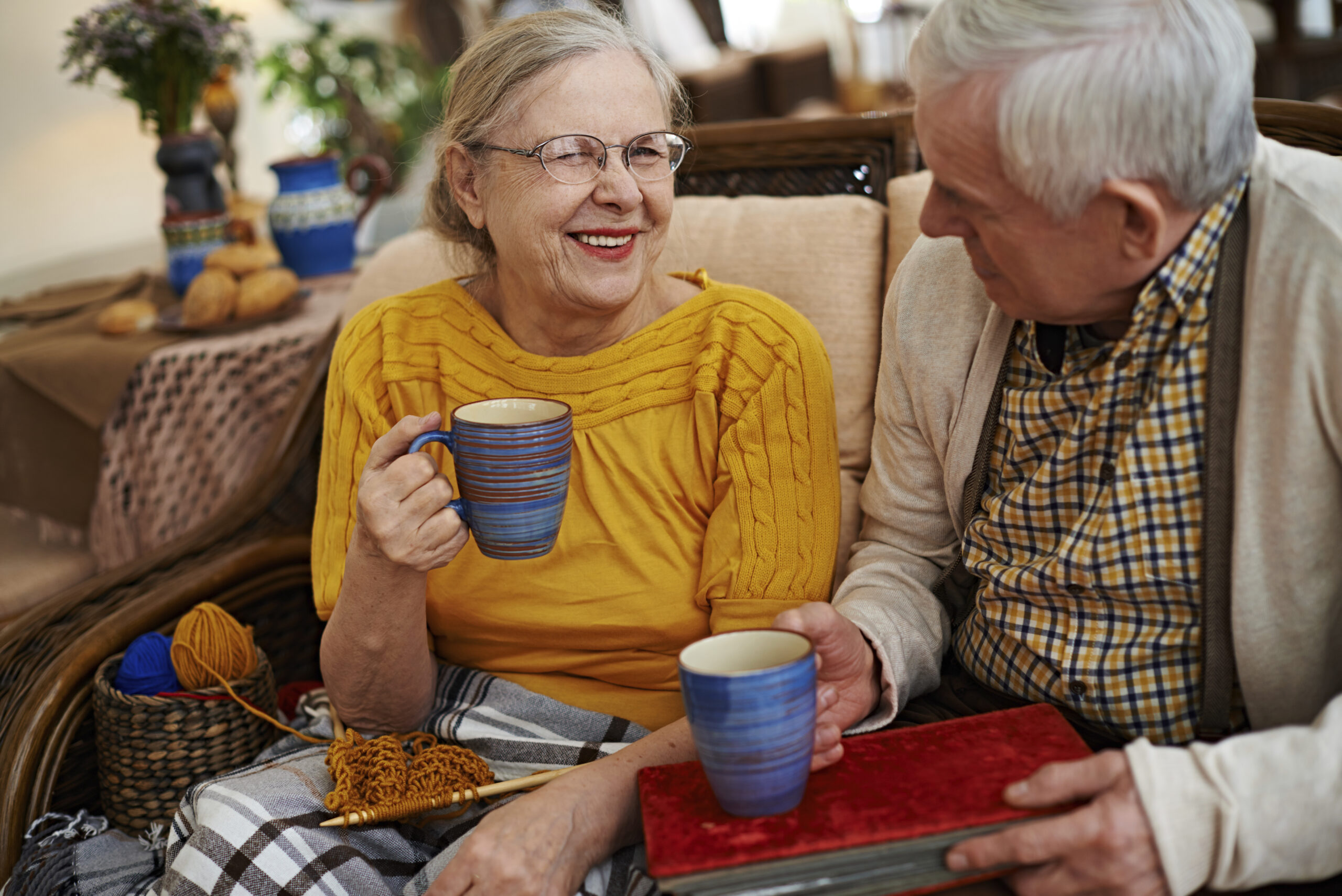 “A relaxed moment for a senior couple: enjoying hobbies, laughter, and companionship, showcasing how respite care can provide both care and a break for loved ones.”